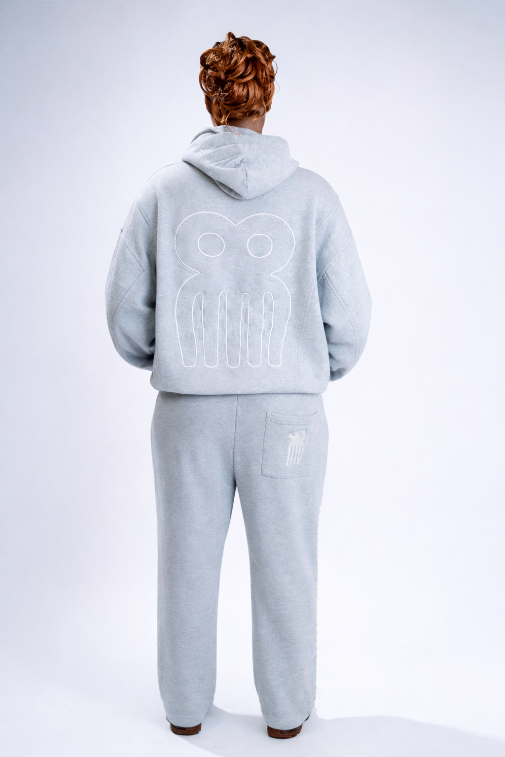 CHACHI Signature Tracksuit Set in gray, flat lay of hoodie and joggers