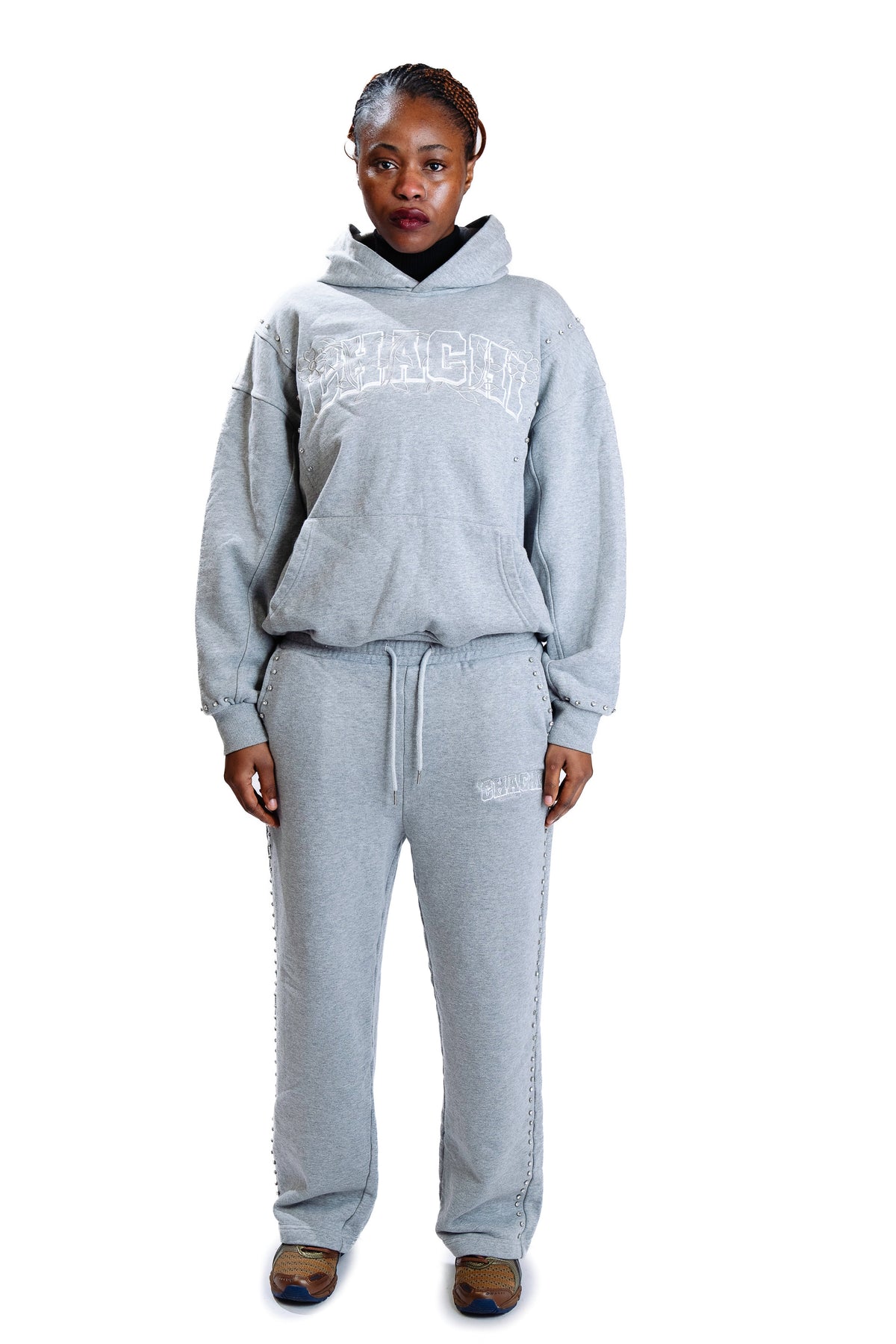 Model wearing CHACHI Signature Hoodie in gray